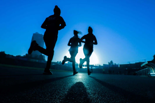 Runners jogging at night