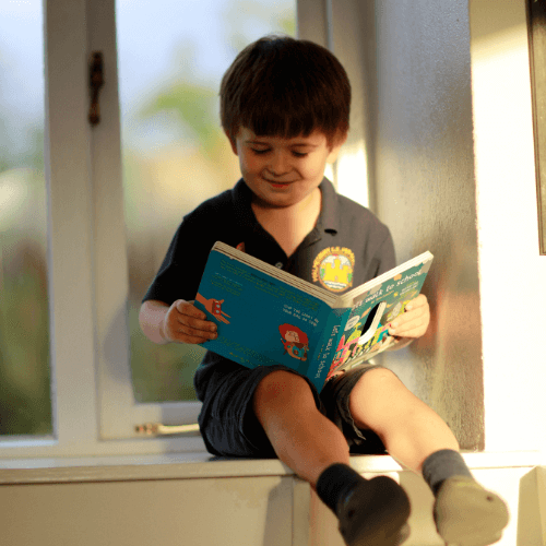 Boy reading Million Mile Light Kids Book